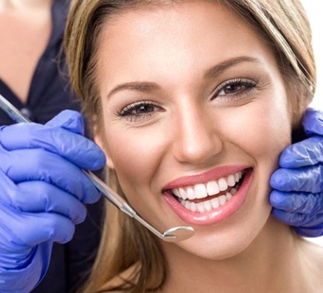 a patient smiling after receiving teeth whitening in Corpus Christi